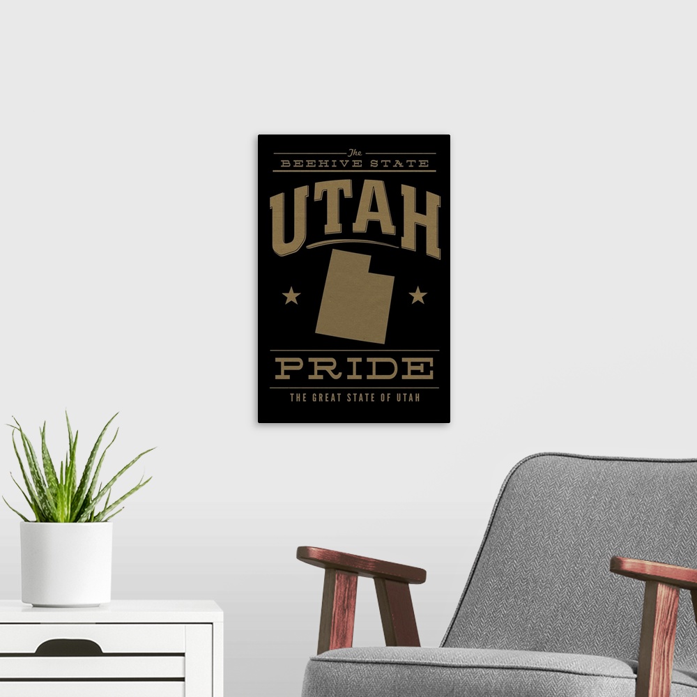 A modern room featuring The Utah state outline on black with gold text.