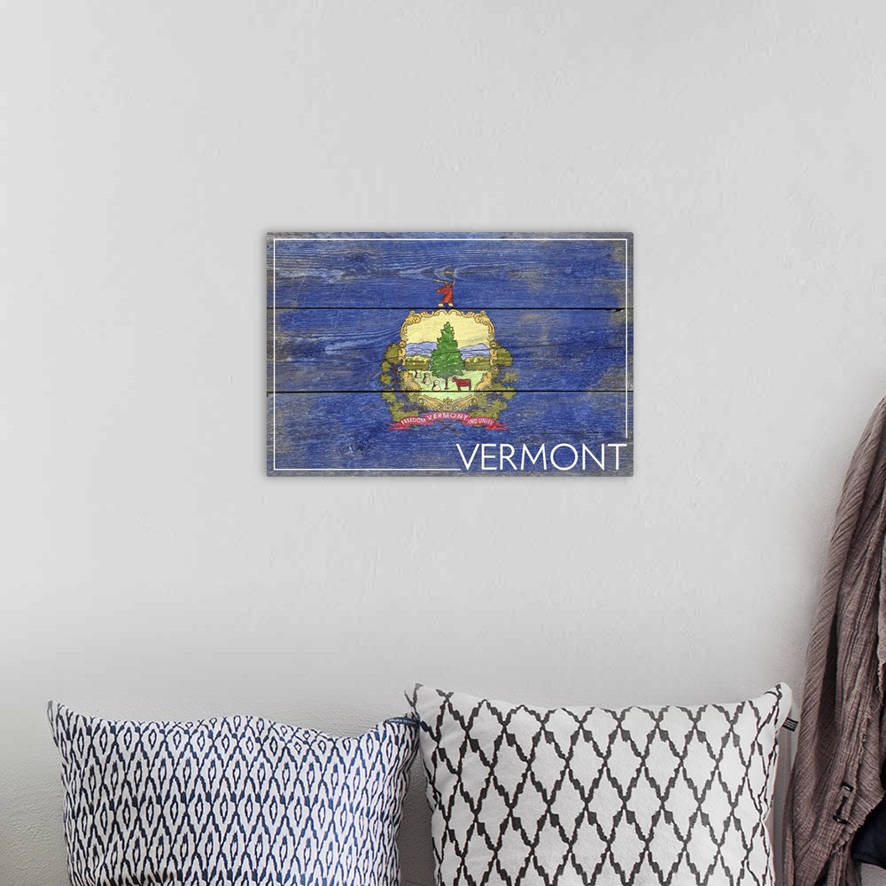 A bohemian room featuring The flag of Vermont with a weathered wooden board effect.