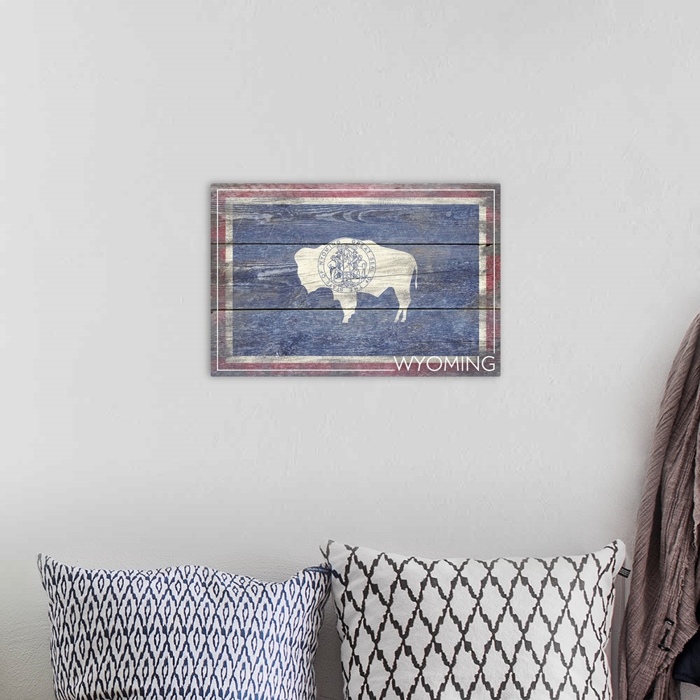 A bohemian room featuring The flag of Wyoming with a weathered wooden board effect.