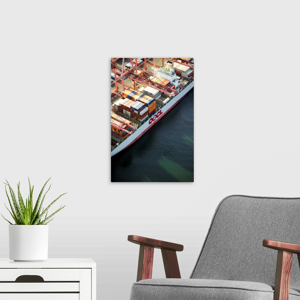 A modern room featuring Crane loading cargo onto container ship, Port of Seattle, WA - Aerial Photograph