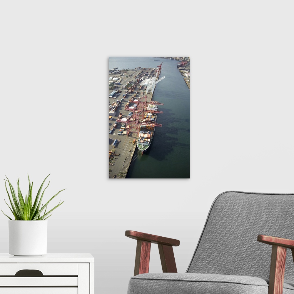 A modern room featuring Cranes loading a container ship at Port of Seattle, WA, USA - Aerial Photograph