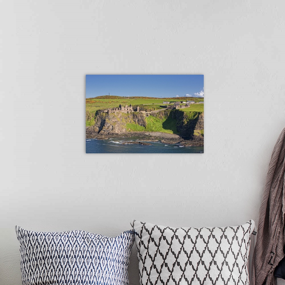 A bohemian room featuring Dunluce Castle, Bushmills, Northern Ireland, UK - Aerial Photograph