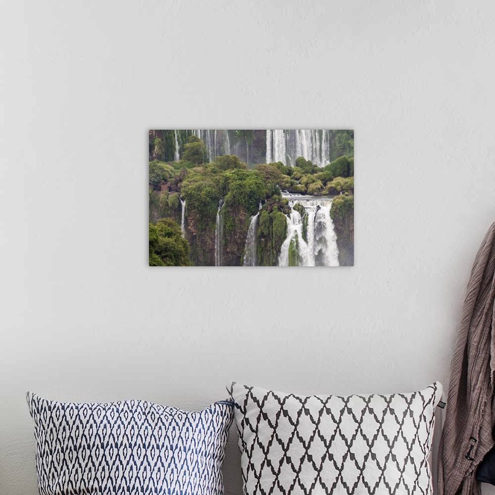 A bohemian room featuring Photograph of massive waterfalls flowing down over lush jungle cliffs.