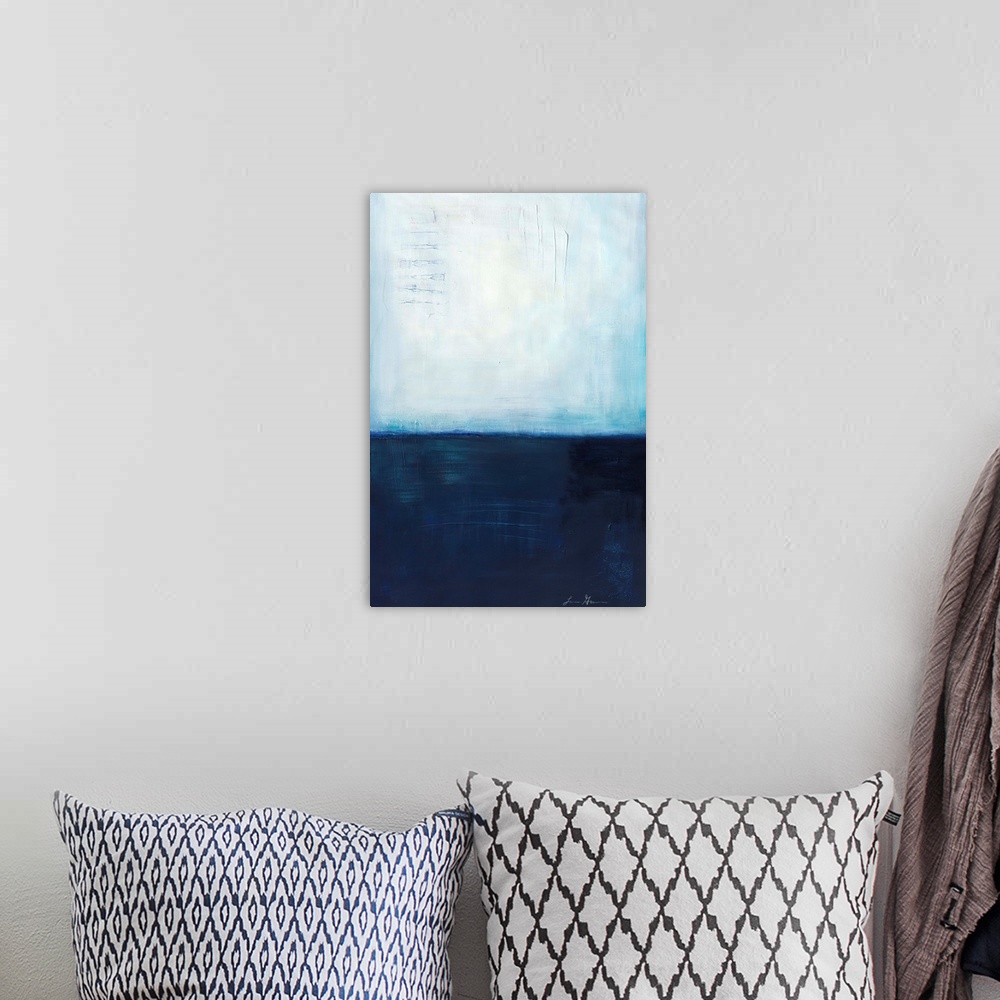 A bohemian room featuring Contemporary abstract painting using dark blue and light blue colors meeting almost in the middle...