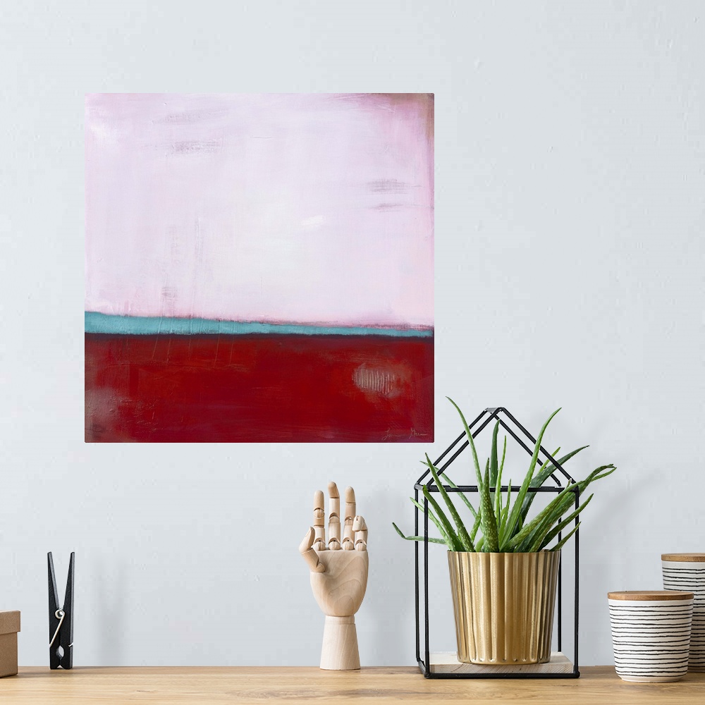 A bohemian room featuring Square, abstract painting featuring large blocks of color in pink and red with light blue accents