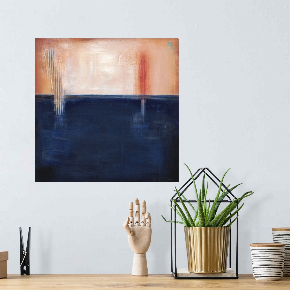 A bohemian room featuring Square, abstract painting featuring large blocks of color in peach and navy