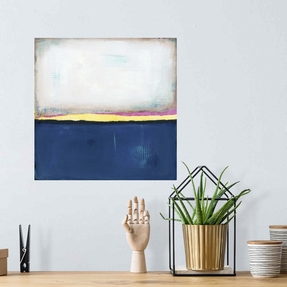 A bohemian room featuring Square, abstract painting featuring large blocks of color in white and dark blue with yellow and ...