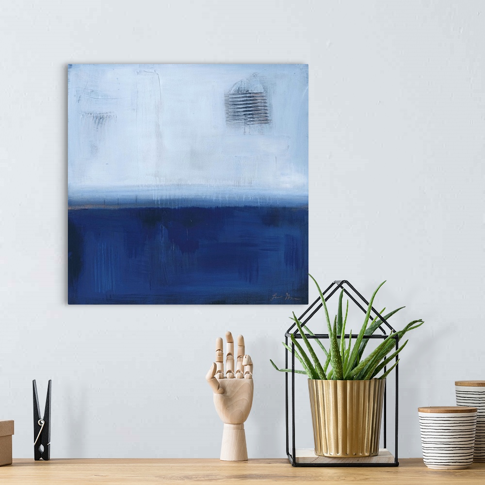 A bohemian room featuring Square, abstract painting featuring large blocks of color in light and dark blue