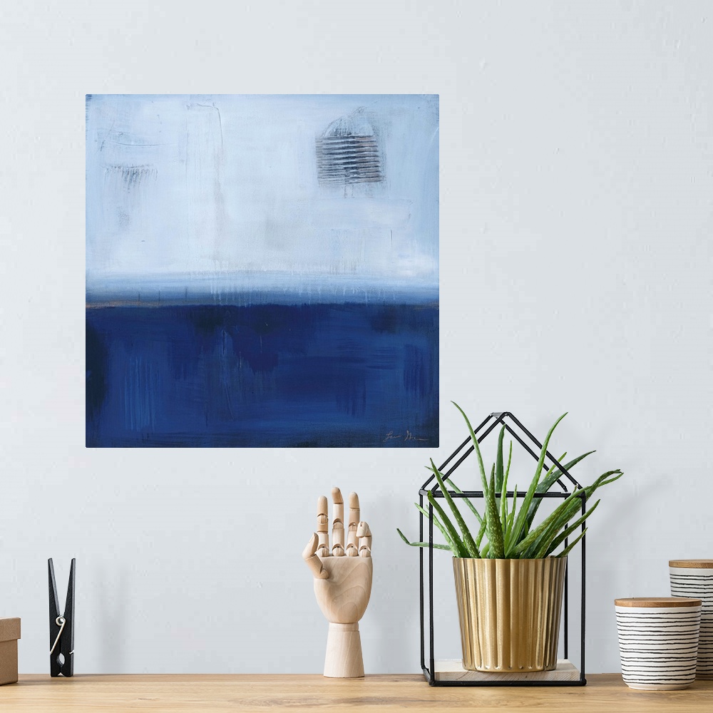 A bohemian room featuring Square, abstract painting featuring large blocks of color in light and dark blue