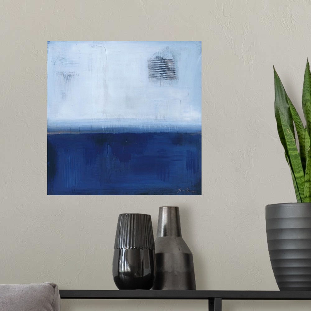 A modern room featuring Square, abstract painting featuring large blocks of color in light and dark blue