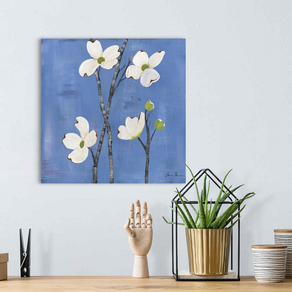 A bohemian room featuring Contemporary painting of dogwood flowers against a blue background.