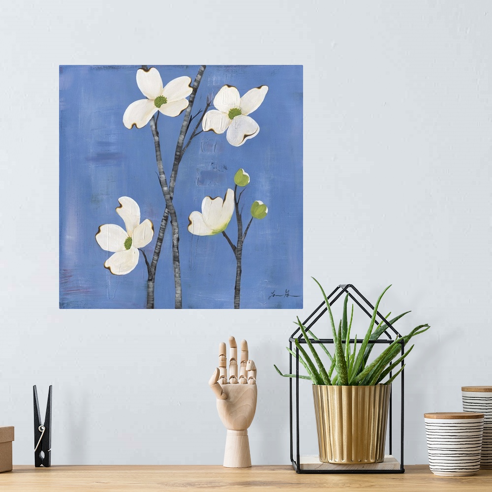 A bohemian room featuring Contemporary painting of dogwood flowers against a blue background.