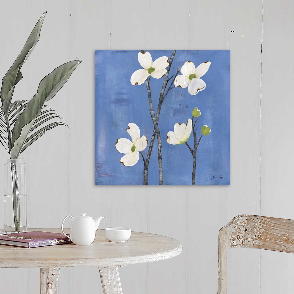 A farmhouse room featuring Contemporary painting of dogwood flowers against a blue background.