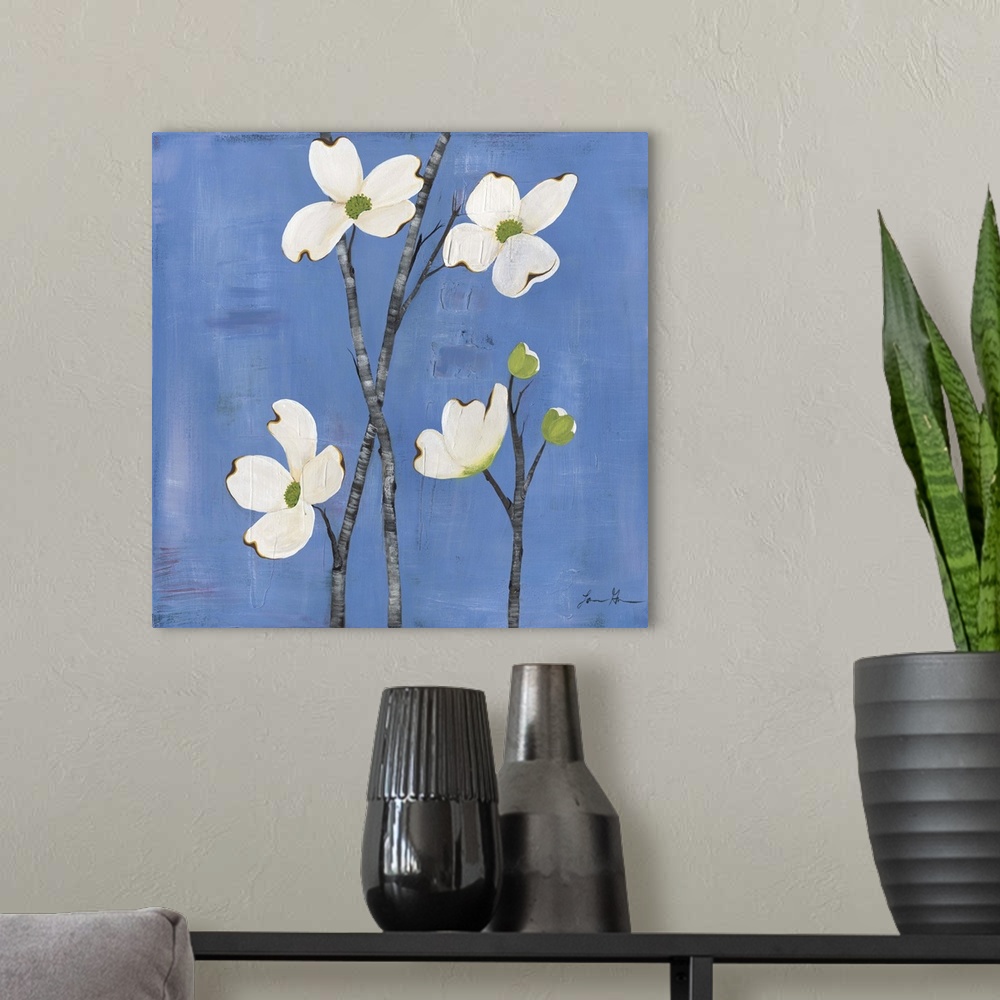 A modern room featuring Contemporary painting of dogwood flowers against a blue background.