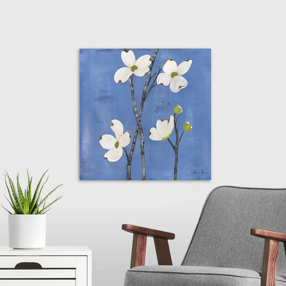 A modern room featuring Contemporary painting of dogwood flowers against a blue background.