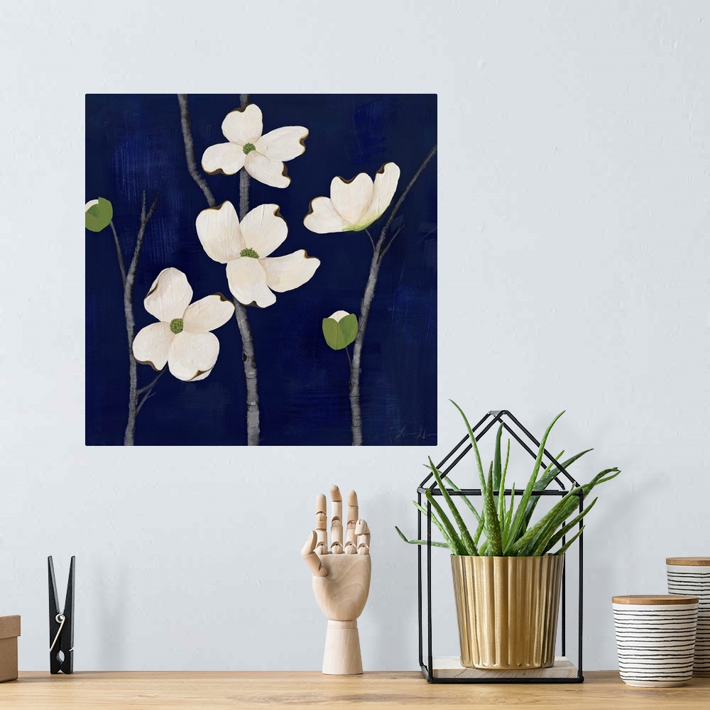 A bohemian room featuring Contemporary painting of dogwood flowers against a dark blue background.
