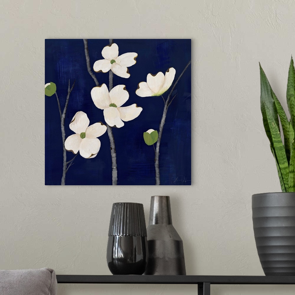 A modern room featuring Contemporary painting of dogwood flowers against a dark blue background.