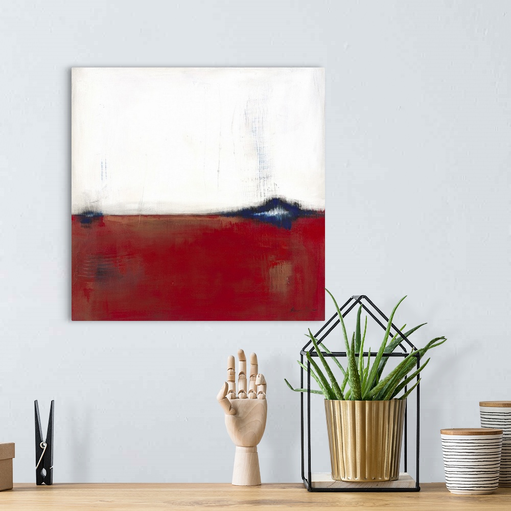 A bohemian room featuring Square, abstract painting featuring large blocks of color in white and red with blue accents