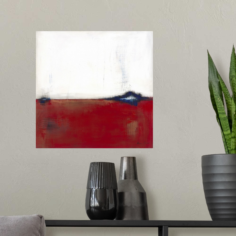 A modern room featuring Square, abstract painting featuring large blocks of color in white and red with blue accents