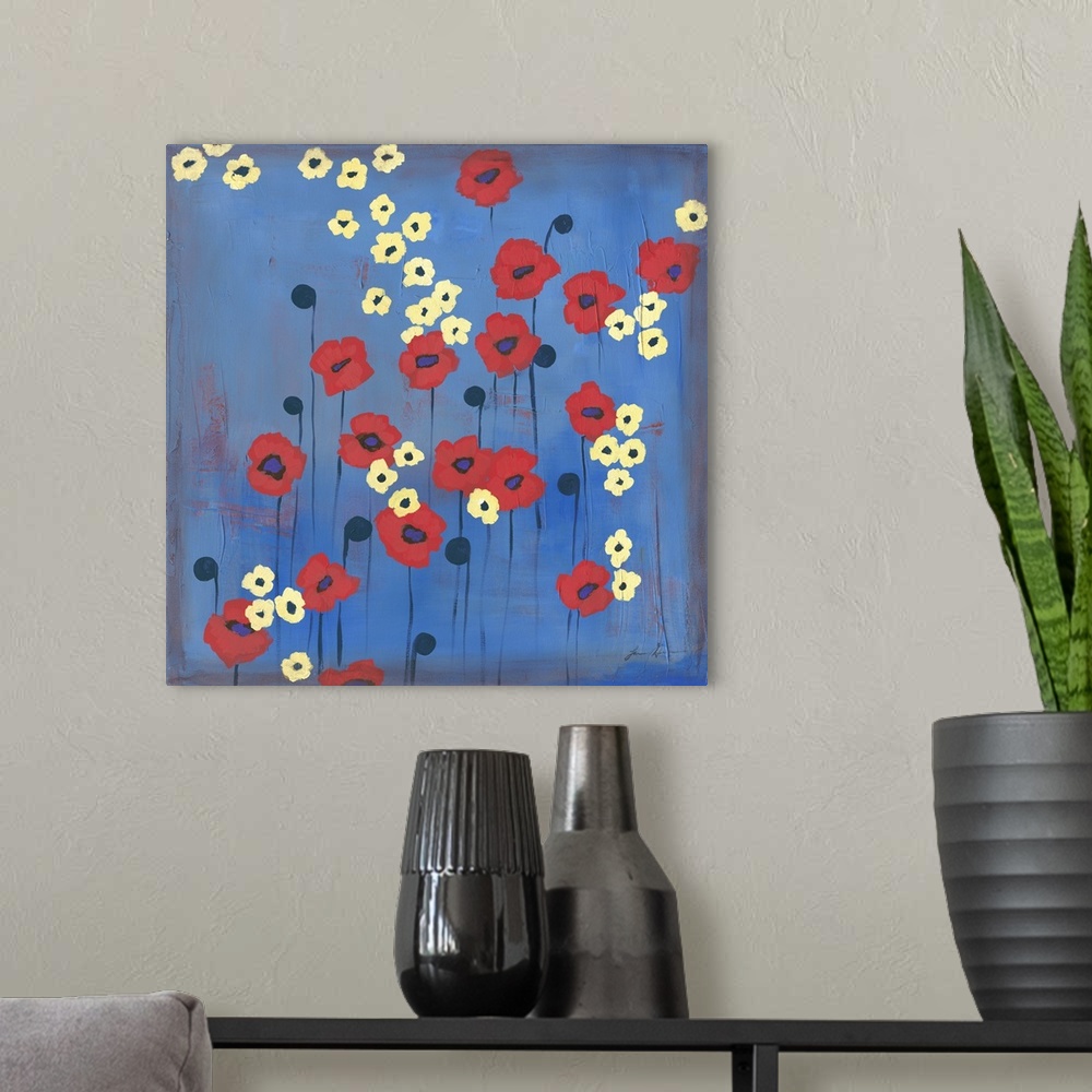 A modern room featuring Contemporary painting of red and yellow flowers against a blue background.