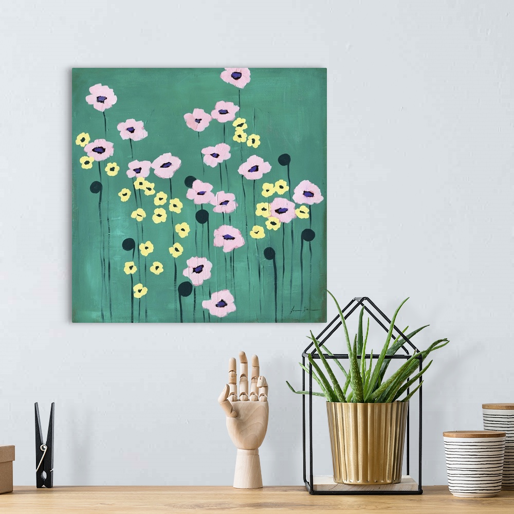 A bohemian room featuring Contemporary painting of pink and yellow flowers against a green background.