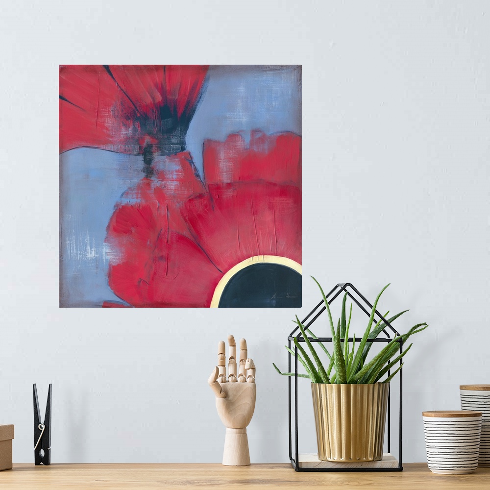 A bohemian room featuring Contemporary painting of red poppies seen very close-up against a blue background.