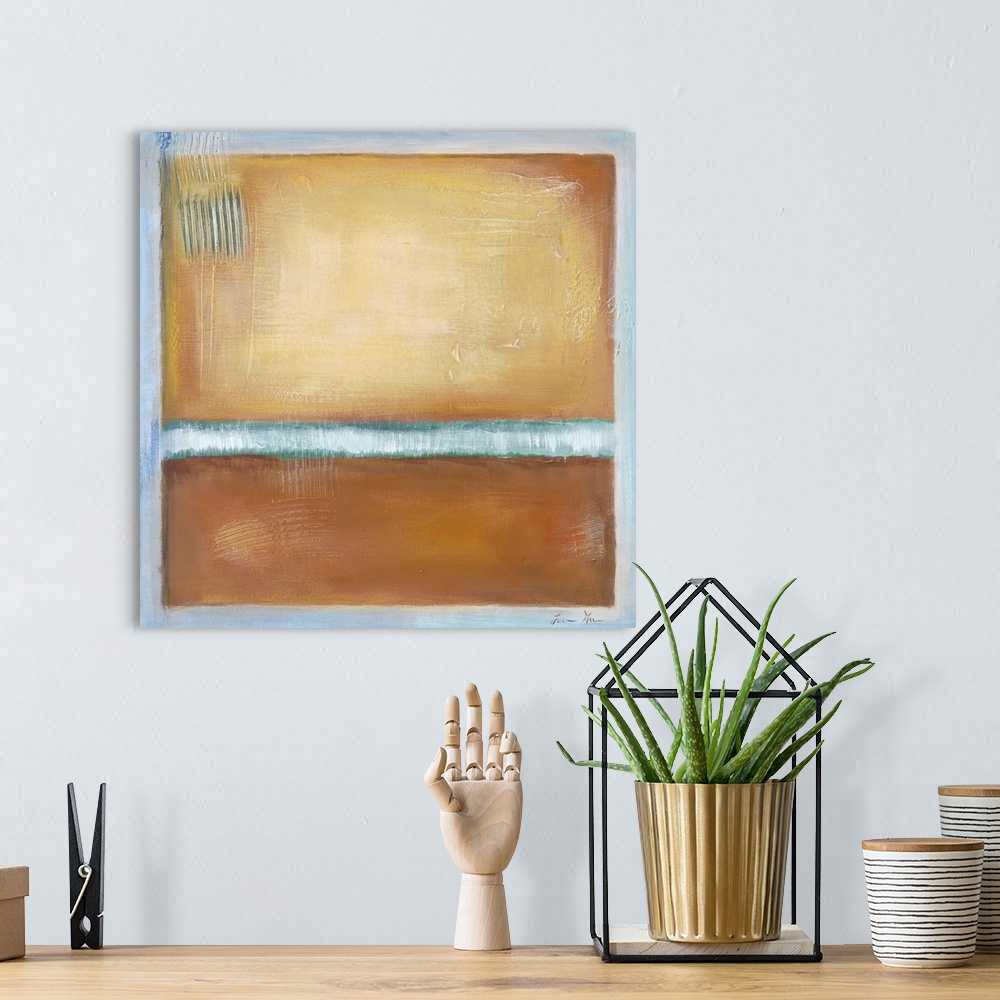 A bohemian room featuring Square, abstract painting featuring large blocks of color in tan with light blue accents