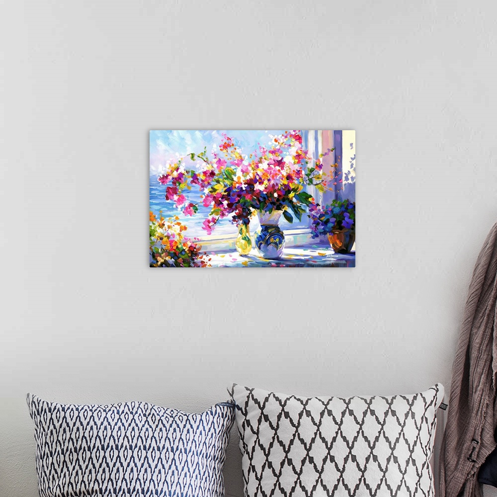 A bohemian room featuring In this contemporary impressionistic piece, a vase is filled with vibrant flowers, their colors s...