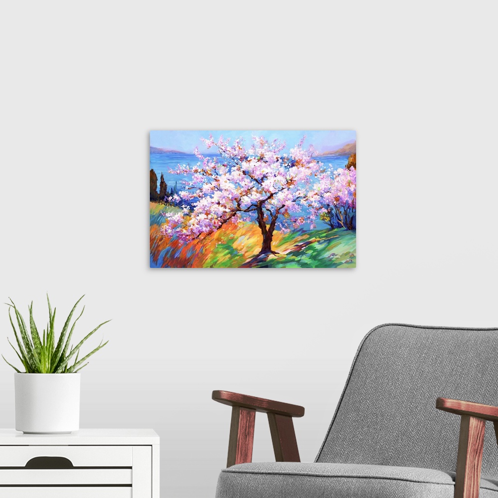 A modern room featuring This impressionistic artwork captures a cherry blossom tree's delicate beauty, arrayed in soft, c...