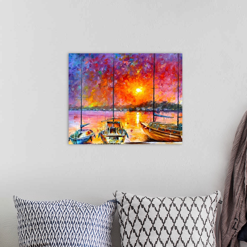 A bohemian room featuring Warm and bold colored painting of sailboats docked in front of a sunset.