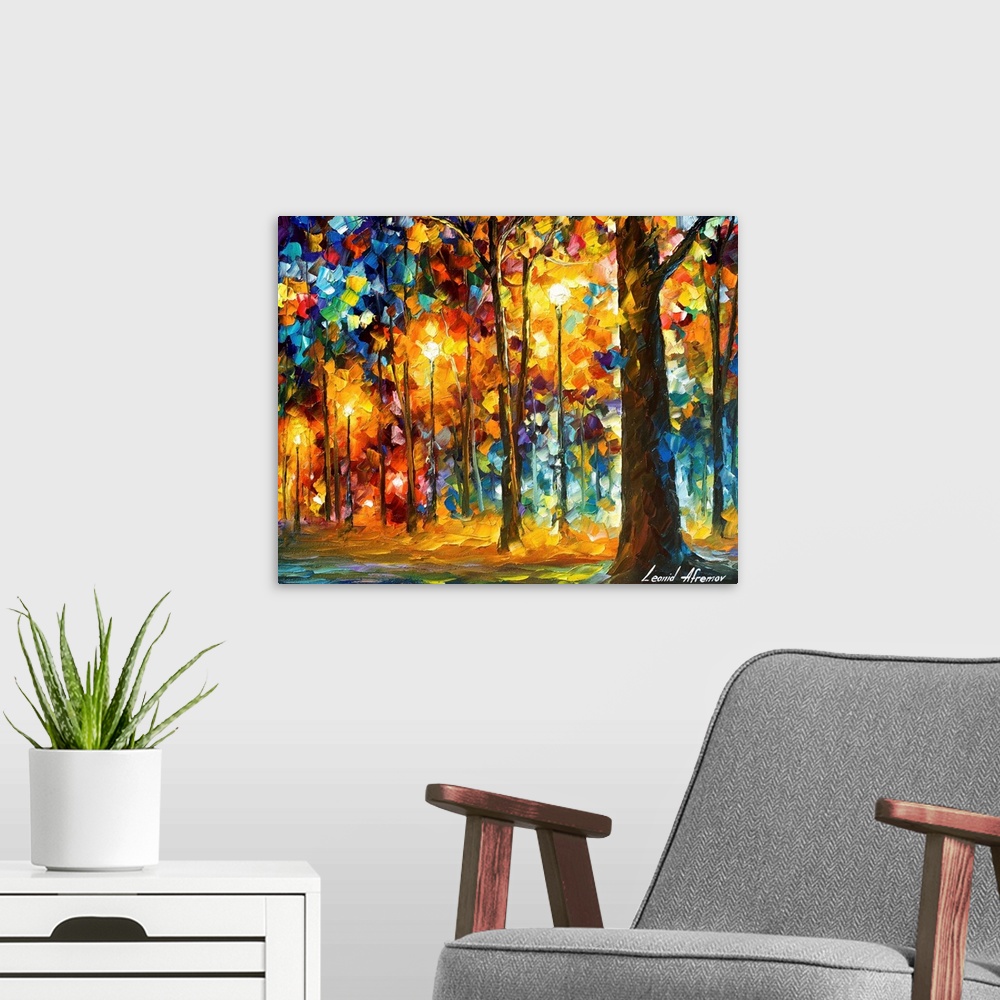 A modern room featuring Contemporary colorful painting of a line of trees and light posts illuminated in the evening.