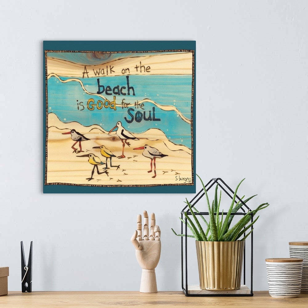 A bohemian room featuring Birds and seagulls on a beach with water and a saying