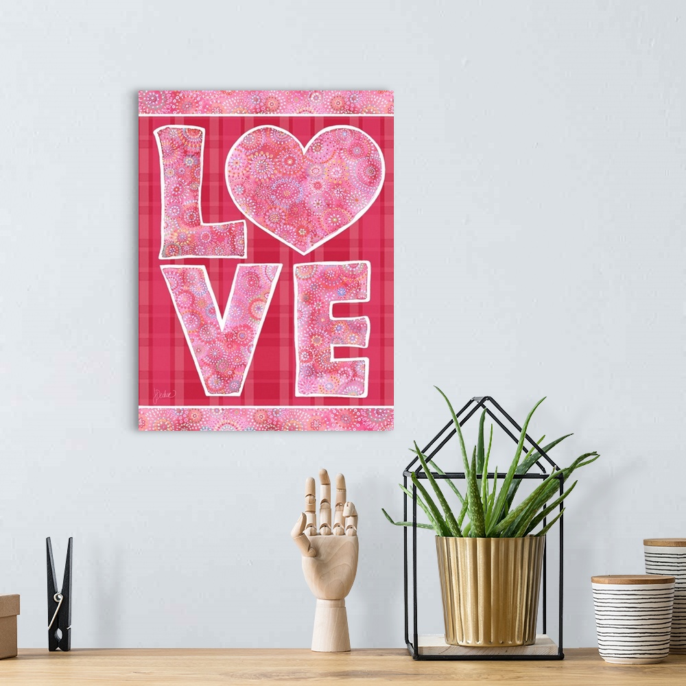 A bohemian room featuring Love design in pink on plaid. Decorative lettering and patterns.