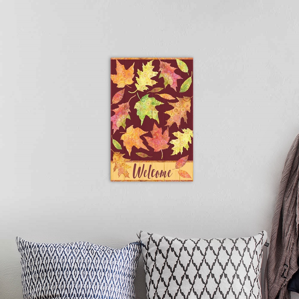 A bohemian room featuring Welcome fall with colorful patterned leaves on rich maroon painted board background.