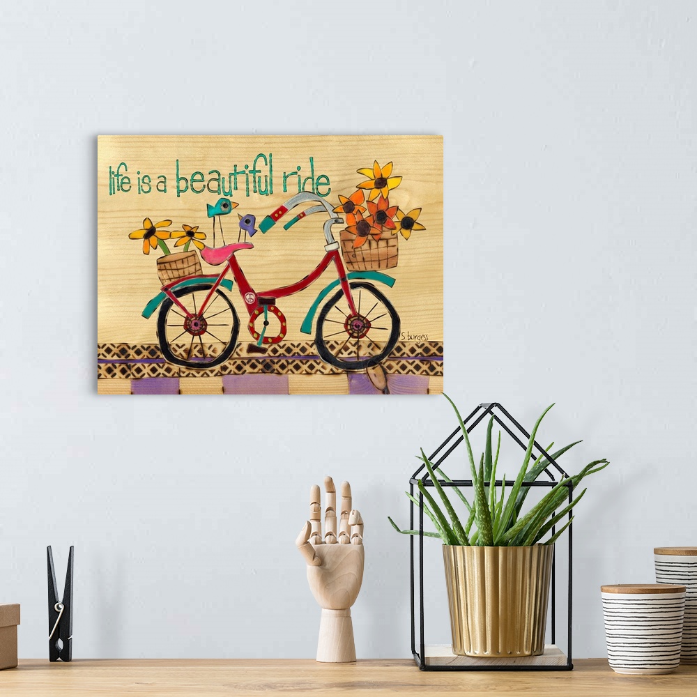 A bohemian room featuring Bike with basket full of flowers and saying