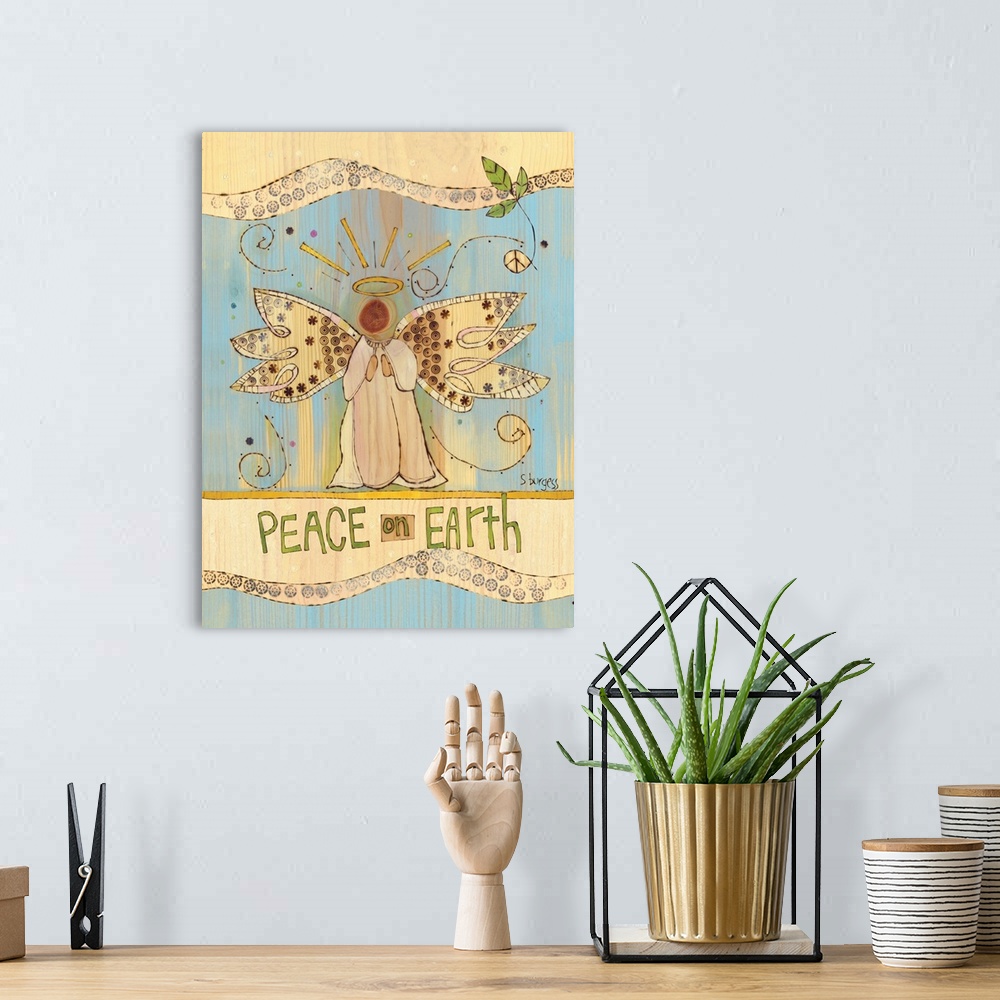 A bohemian room featuring Angel with cream and blue background and saying.