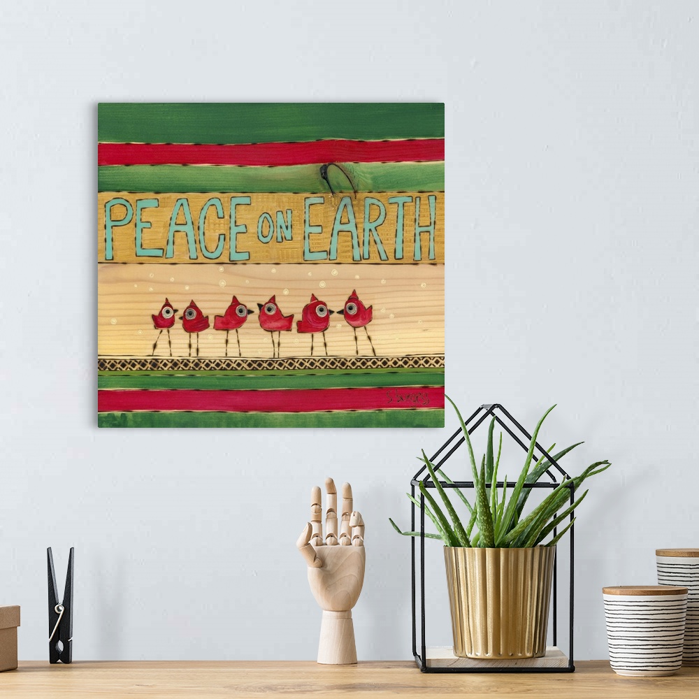 A bohemian room featuring Cardinals with snow with green and red stripes with saying
