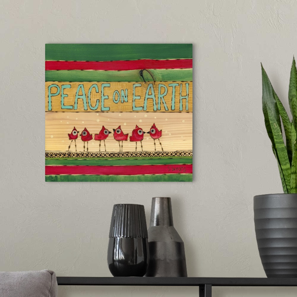 A modern room featuring Cardinals with snow with green and red stripes with saying