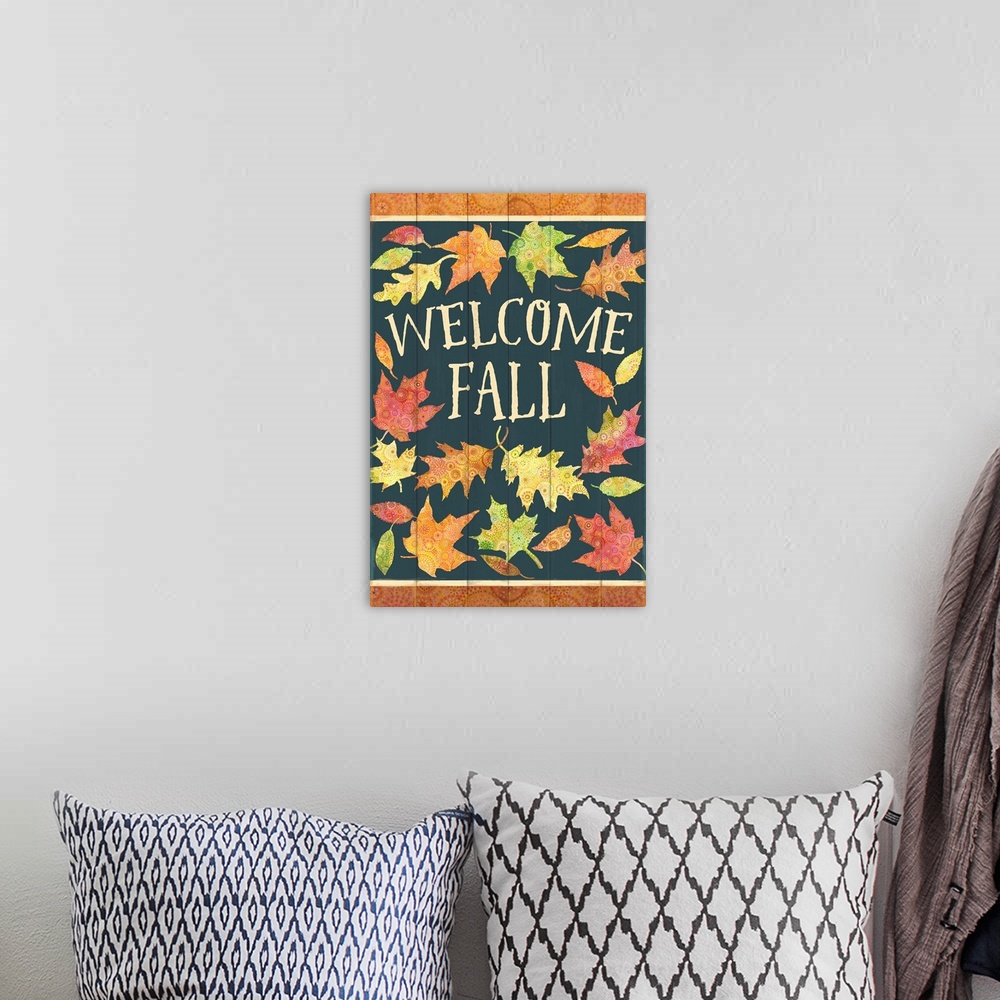 A bohemian room featuring Colorful patterned leaves welcome fall on a green painted board background.