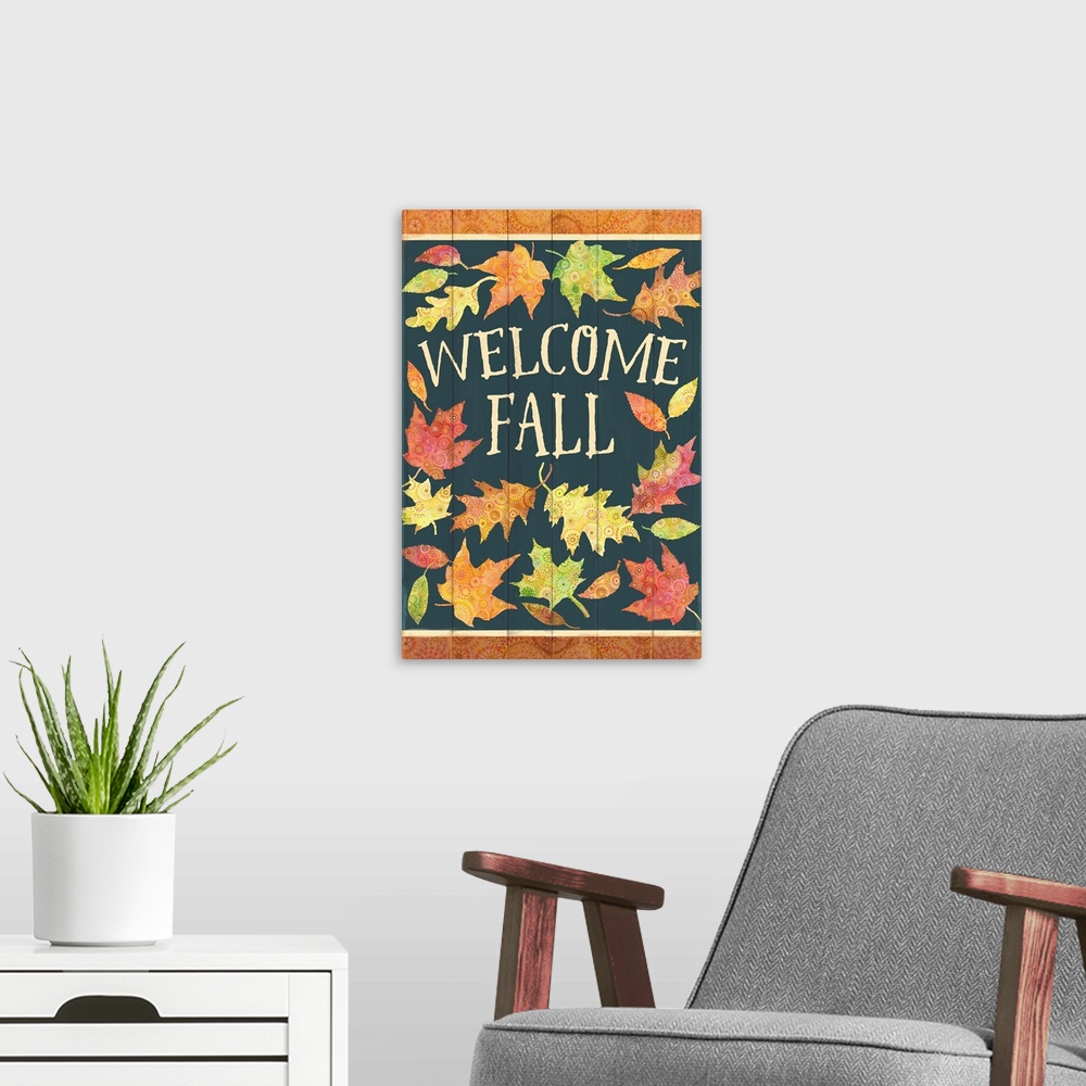 A modern room featuring Colorful patterned leaves welcome fall on a green painted board background.