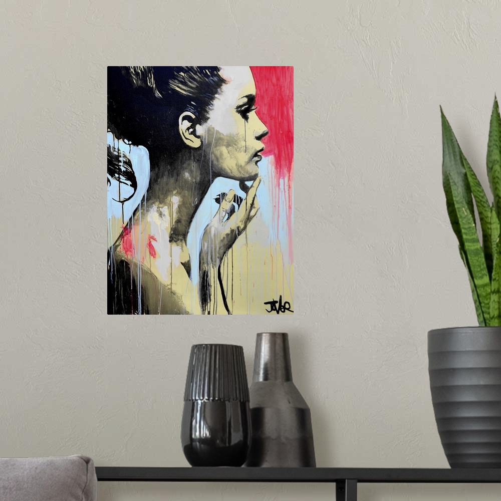 A modern room featuring Contemporary urban artwork of a woman in profile against a background of vibrant dripping paint.