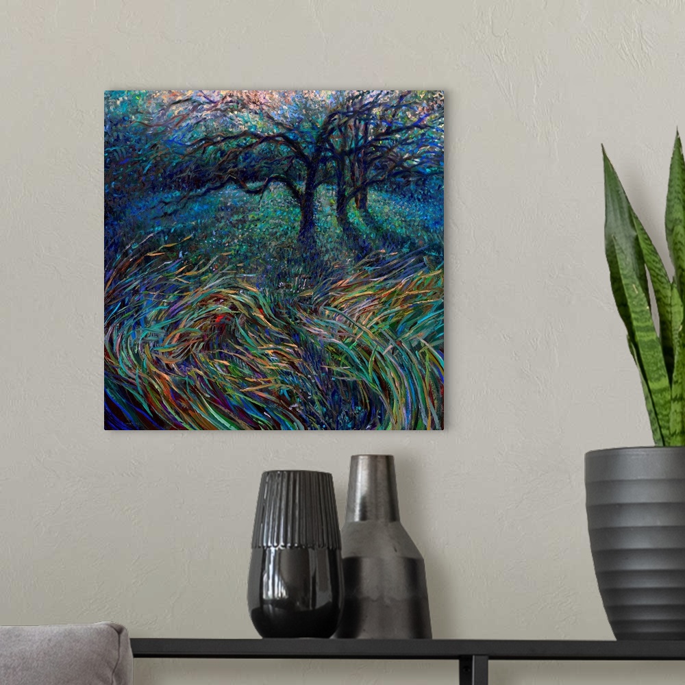 A modern room featuring Brightly colored contemporary artwork of trees in a field.