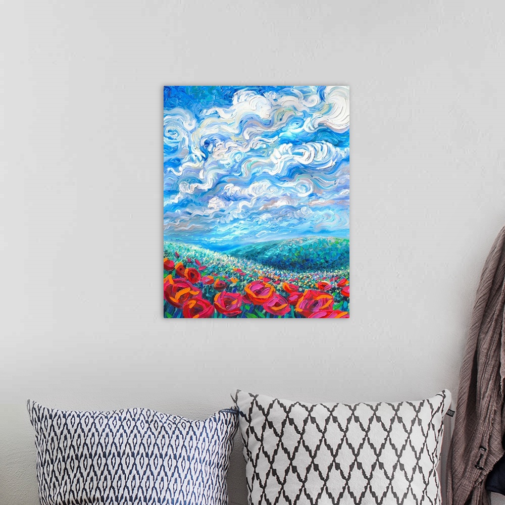 A bohemian room featuring Brightly colored contemporary artwork of a landscape with flowers.