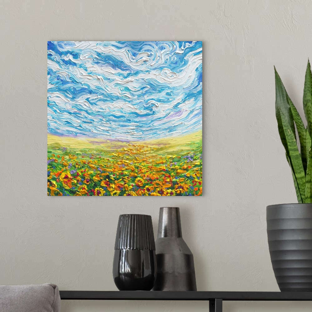 A modern room featuring Brightly colored contemporary artwork of a landscape with sunflower field.