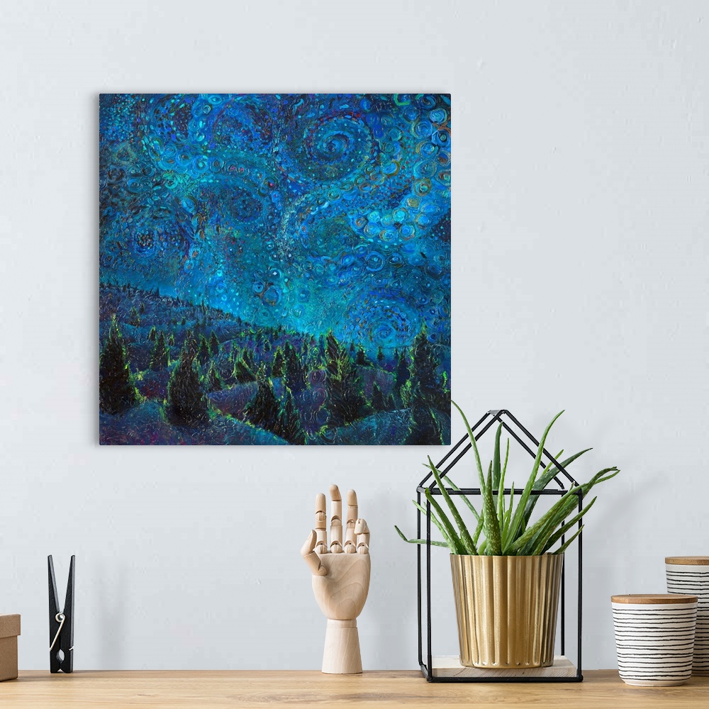 A bohemian room featuring Brightly colored contemporary artwork of a landscape of trees at night.