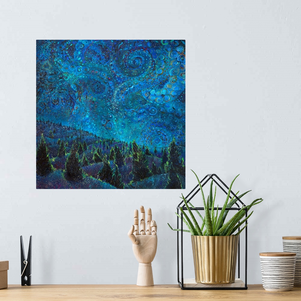 A bohemian room featuring Brightly colored contemporary artwork of a landscape of trees at night.
