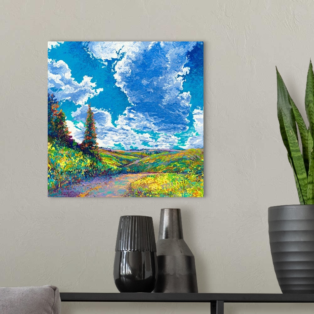 A modern room featuring Brightly colored contemporary artwork of a landscape with road and trees.