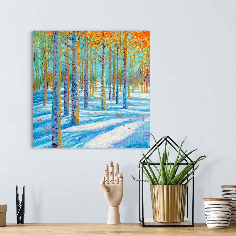 A bohemian room featuring Brightly colored contemporary artwork of a landscape of trees in the snow.