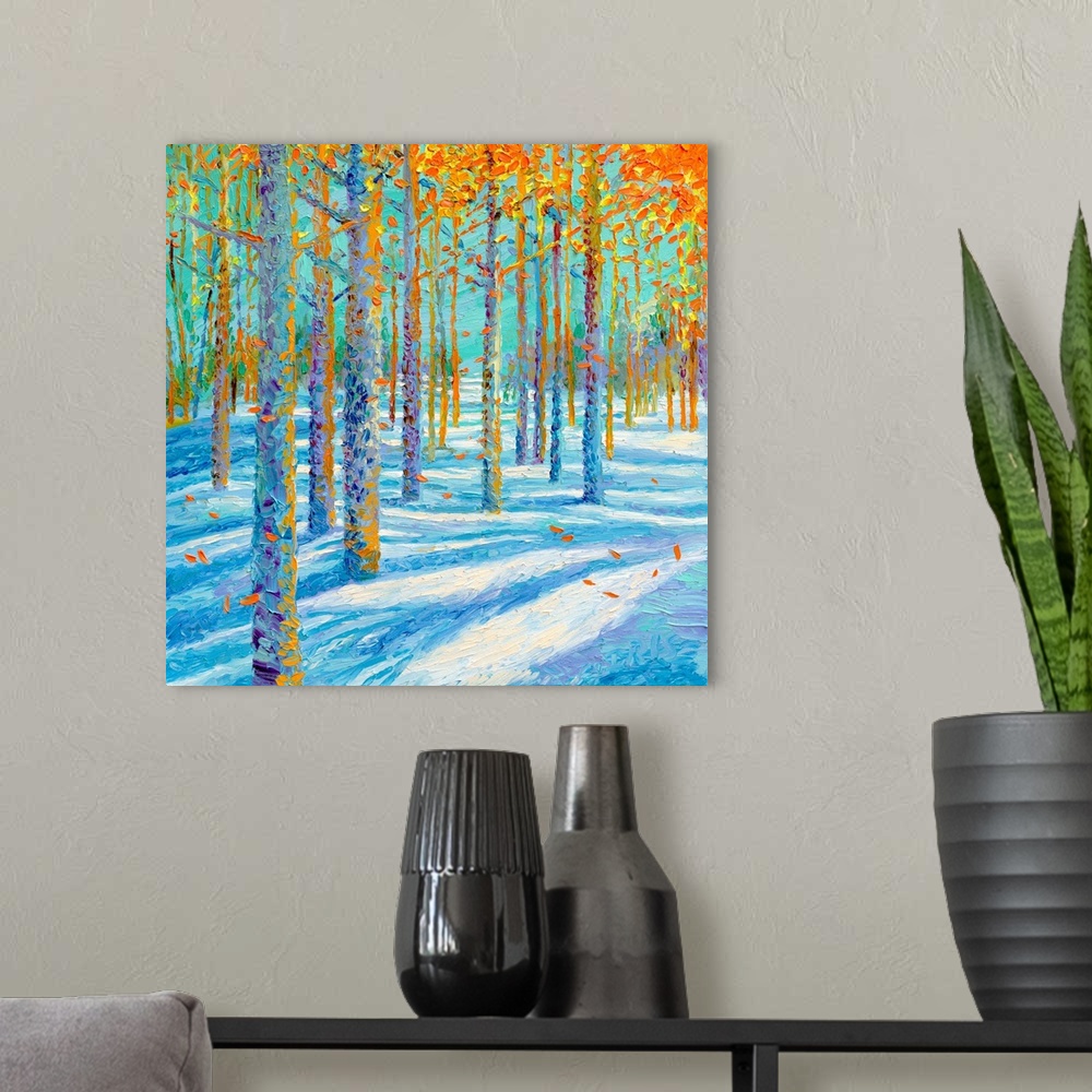 A modern room featuring Brightly colored contemporary artwork of a landscape of trees in the snow.
