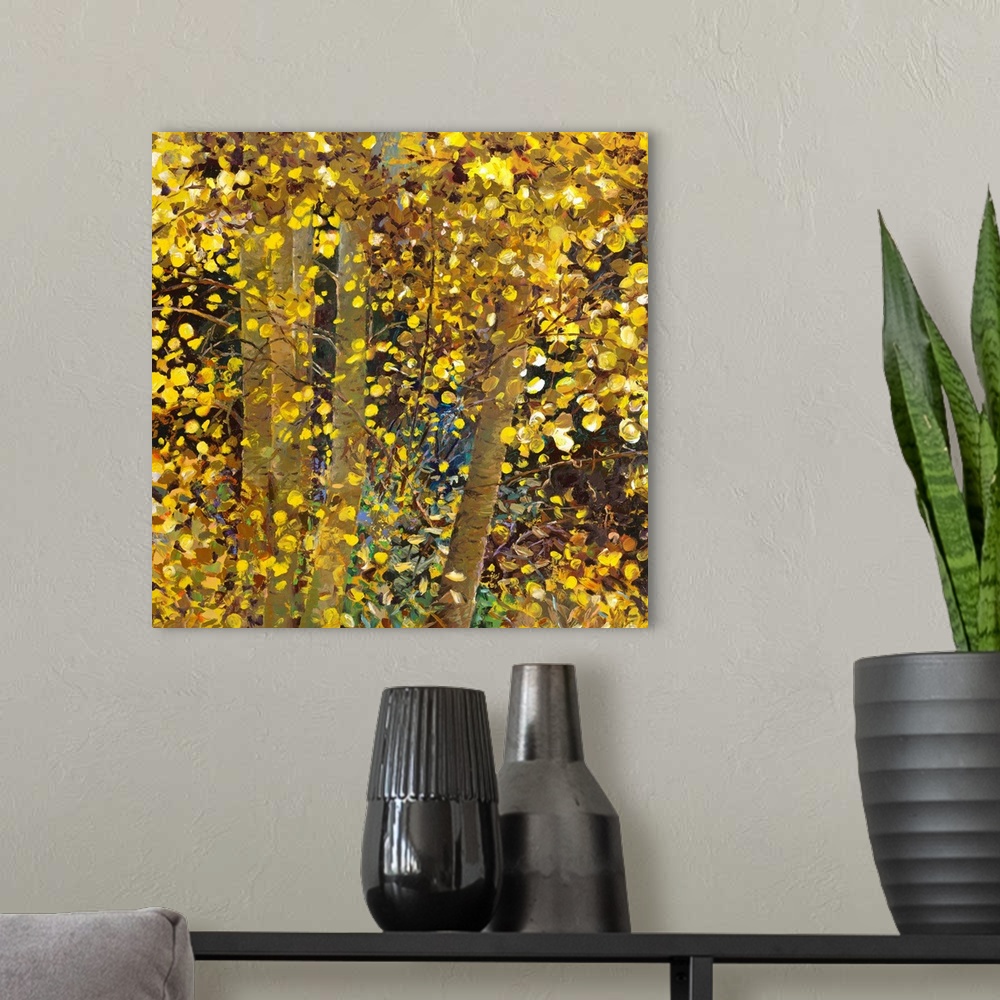 A modern room featuring Brightly colored contemporary artwork of yellow trees.